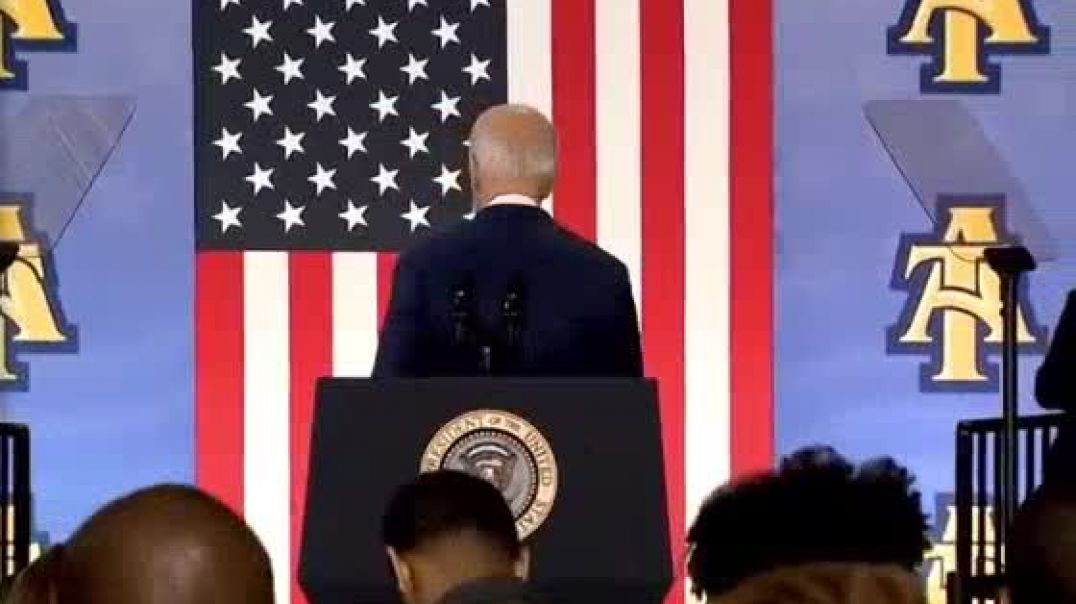 Biden tries to shake hands with thin air or a demon after N.C. speech
